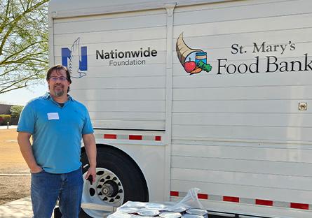 Robert Martin, SCC 2025 Educator of the Year with St. Mary's Food Bank truck