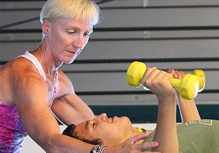 personal trainer with student