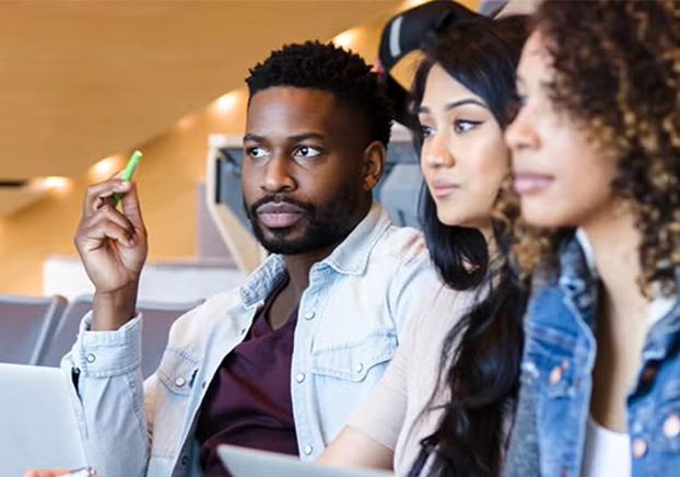 students intently listening to the instructor